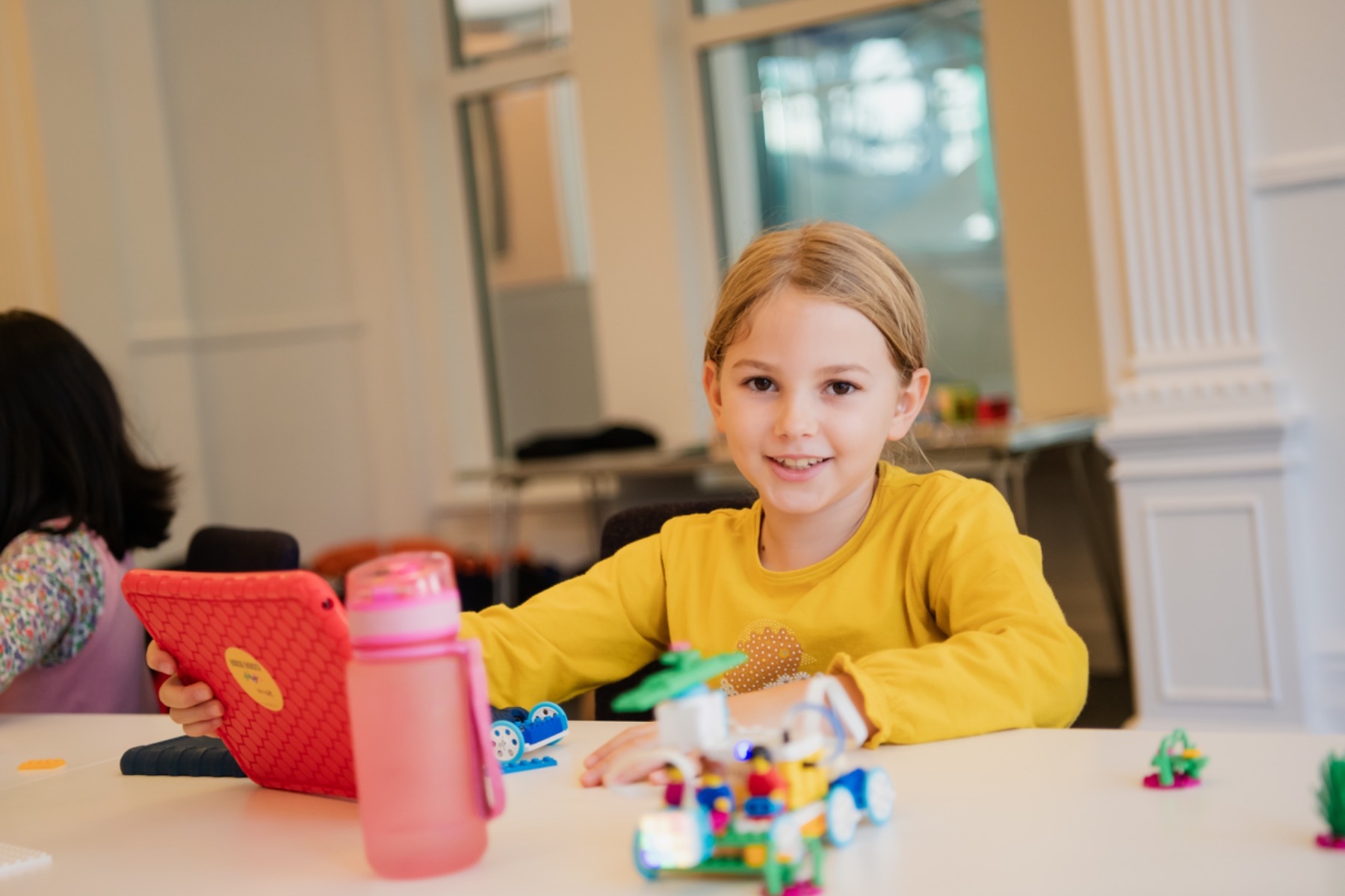 Children in a Code Kids robotics class